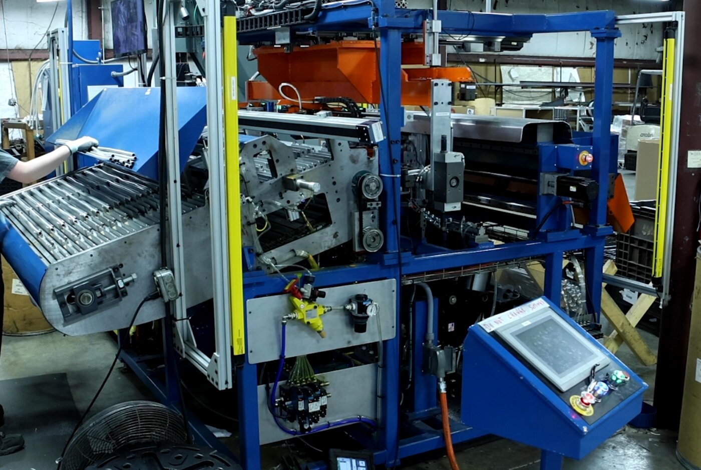 Bristol-built multi-station hose processing machine with HMI panel and operator